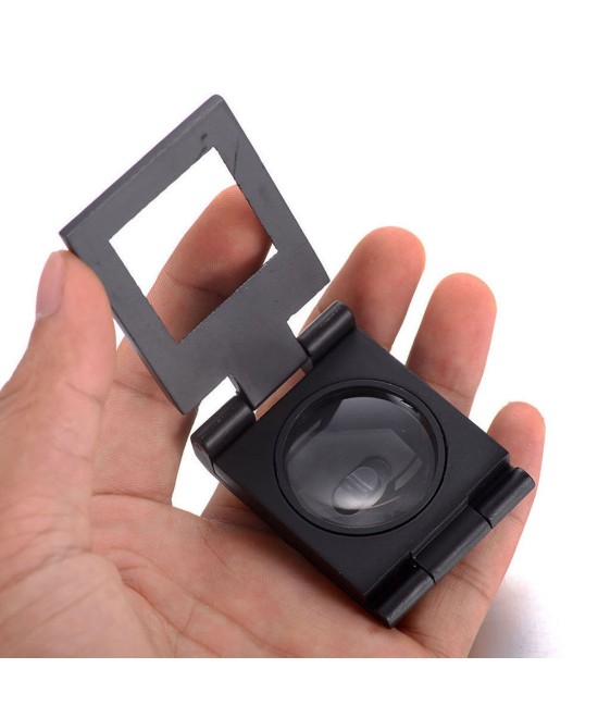 Lupa pequeña con base de metal